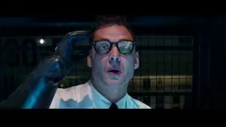 Man in white shirt in dark room with cage — The Amazing Spider Man 2