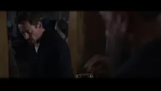 Robert Downey Jr as Tony Stark in dim room — Iron Man 3