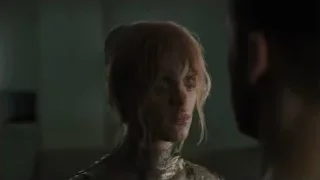 tense woman in dimly lit room — Blade Runner 2049