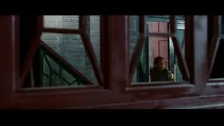 young boy looking out of window — The Karate Kid