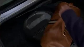 Hand reaching for object in car trunk — Breaking Bad