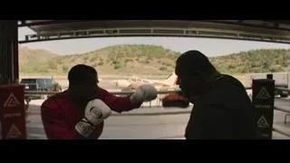 Two men boxing in a ring — Creed 3