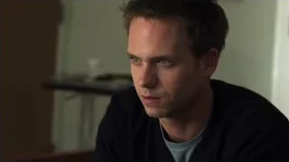 man with serious expression in dimly lit room — Suits