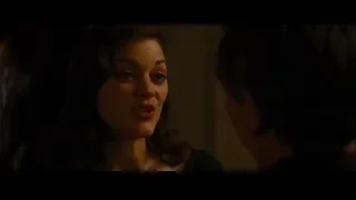 woman's tense face looking at man — Batman: The Dark Knight Rises