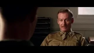 Man in military uniform sitting in room — Hacksaw Ridge