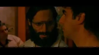 two men conversing in dimly lit room — The Dictator