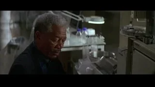 elderly man in laboratory deep in thought — Batman