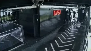 People standing in NASA building — Elon Musk: Return to Space