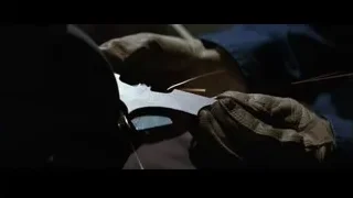 gloved hands working on metal — Batman