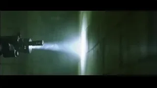 Man wearing helmet and goggles in dim room — The Matrix