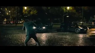 man in suit running on street at night — John Wick: Chapter 4