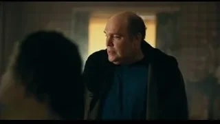 bald man in dark room with woman's head — Joker
