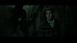 Young man standing in dark stone tunnel — Harry Potter and the Deathly Hallows 2