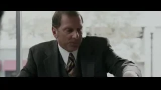 man in suit sitting at office desk — The Persuit of Happyness