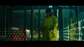 man in yellow jumpsuit at glass door — Deadpool 2