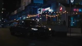 black car on busy street with neon signs — Succession