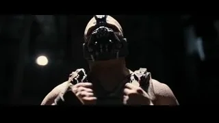 Bane in black mask holding gun — Batman: The Dark Knight Rises