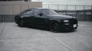 black Rolls-Royce Wraith parked on concrete — Sports Cars