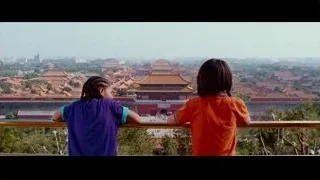 Children on balcony overlooking city with red-roofed temple — The Karate Kid