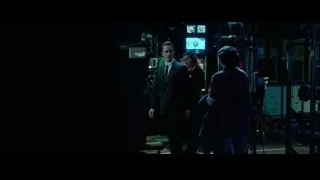 man in suit walking in control room — Steve Jobs