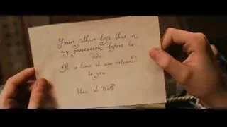 hands holding handwritten note — Harry Potter and the Philosophers Stone
