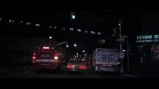 city street at night with ambulances — American Psycho