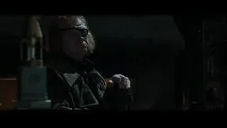 Blonde man with gun in dim room — Harry Potter and the Goblet of Fire