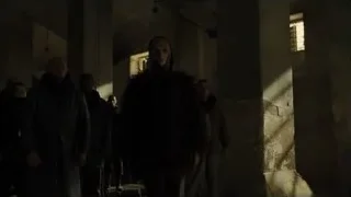 People walking in abandoned concrete building — Blade Runner 2049