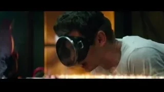 man with goggles looking through magnifying glass — The Amazing Spider Man 2