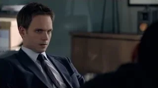 man in suit deep in thought at desk — Suits