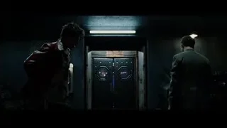 two men with futuristic door in dark room — Fight Club