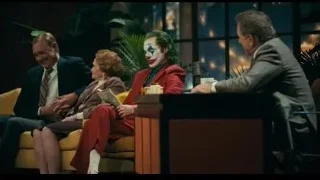 Joker and group on a couch — Joker