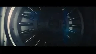 woman walking through circular tunnel structure — Now You See Me