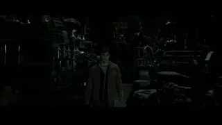 Daniel Radcliffe in dimly lit cluttered room — Harry Potter and the Deathly Hallows 2