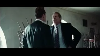 Two men in suits talking in dimly lit room — Steve Jobs