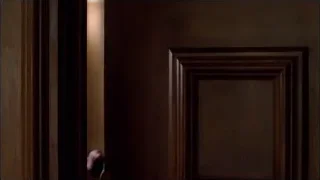 woman looking out wooden door — Breaking Bad