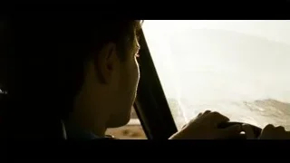 man driving car looking out window — Into the Wild