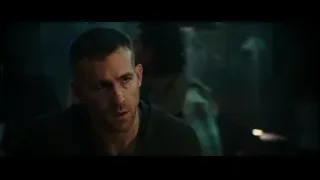 man deep in thought in dimly lit room — Deadpool