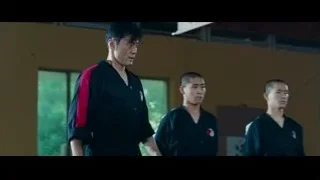 four men in martial arts uniforms standing — The Karate Kid
