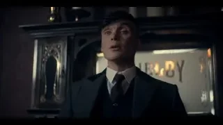 young man in suit by fireplace looking up — Peaky Blinders