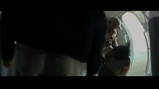 Man lying on ground inside helicopter — Batman: The Dark Knight Rises