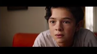 young man looking at camera smiling — Ford v Ferrari