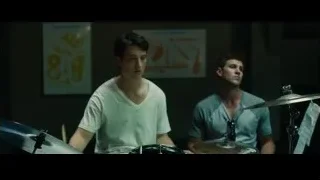 two young men playing drums in dimly lit room — Whiplash