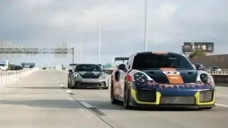 black sports car driving on highway — Sports Cars