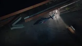 Helicopter flying over city at night — The Avengers