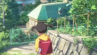 man on balcony overlooking town — Your Name