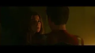 man in red suit and woman facing each other — Spiderman: No Way Home