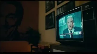 Joker in red suit in dimly lit dressing room — Joker