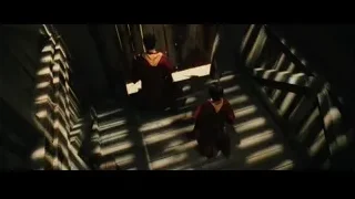 Group walking up wooden stairs in dark room — Harry Potter and the Philosophers Stone