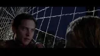 man in spider-suit and woman at night — Spider Man 2